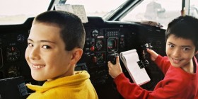 Boys in cockpit of airliner