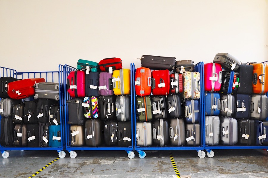 stack of lost luggage